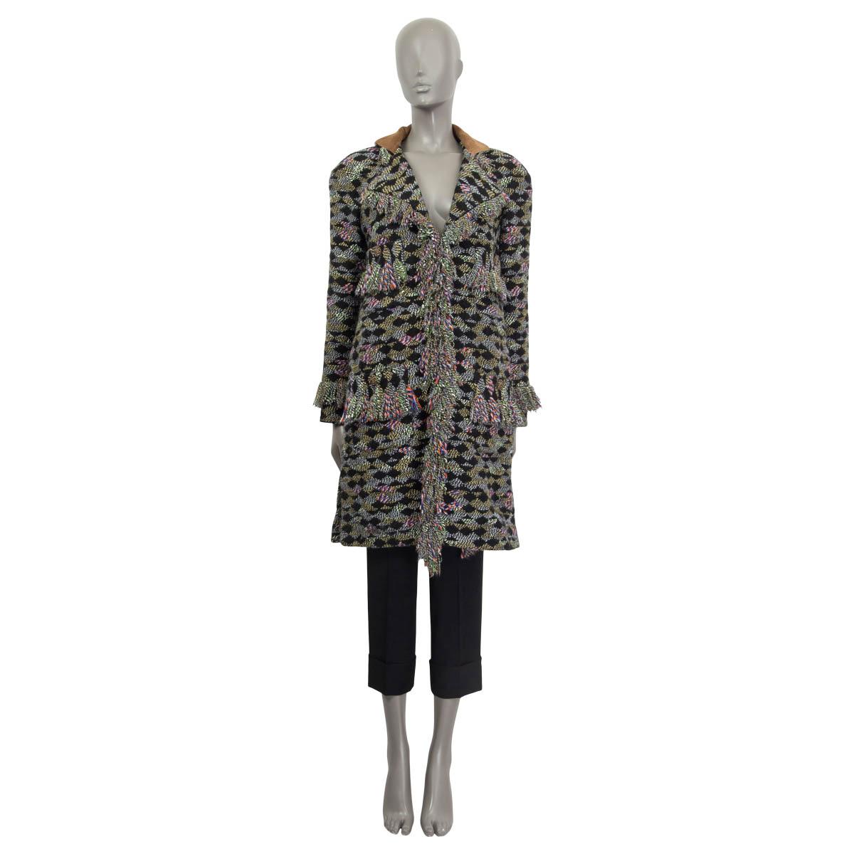 100% authentic Chanel 2015 Salzburg fringed knit coat in black, green, white, orange, yellow and blue acrylic (69%), wool (17%), nylon (5%), silk (5%) and mohair (4%). Features four buttoned pockets on the front and fringe embellishments. Lined in