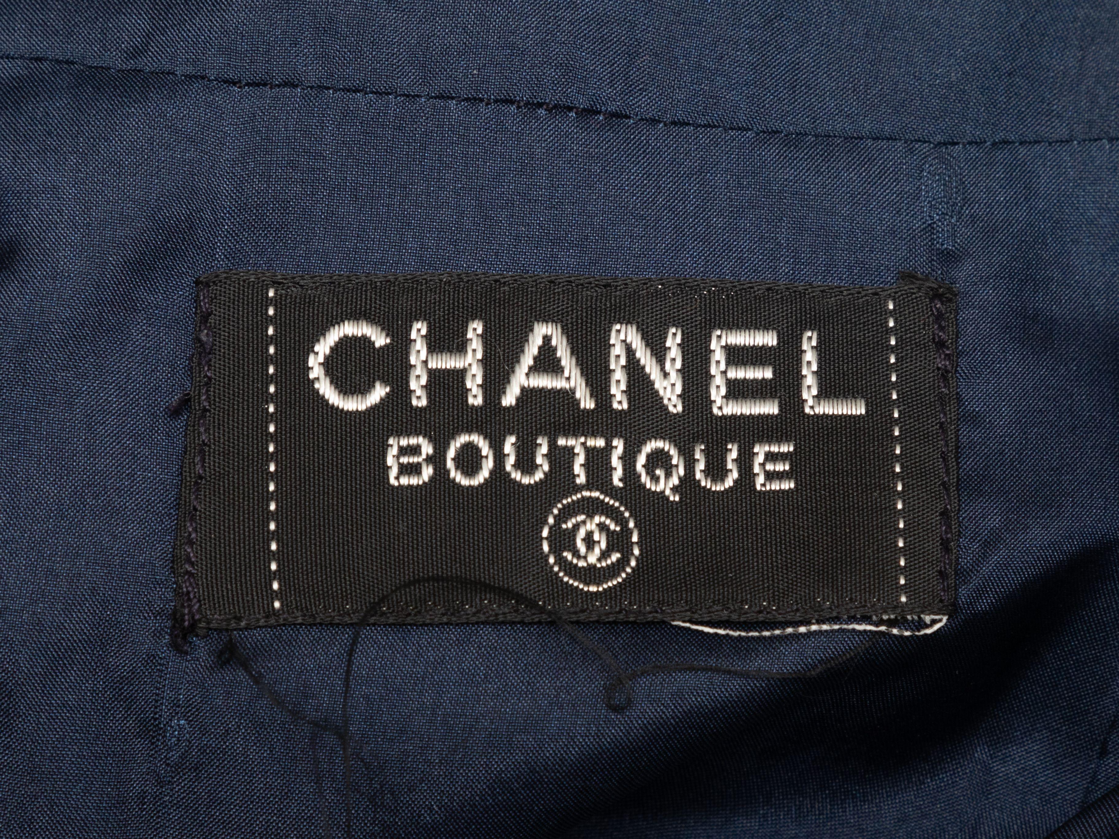 Product Details: Vintage black and multicolor glen plaid tweed pencil skirt by Chanel Boutique. Back zip closure. 32