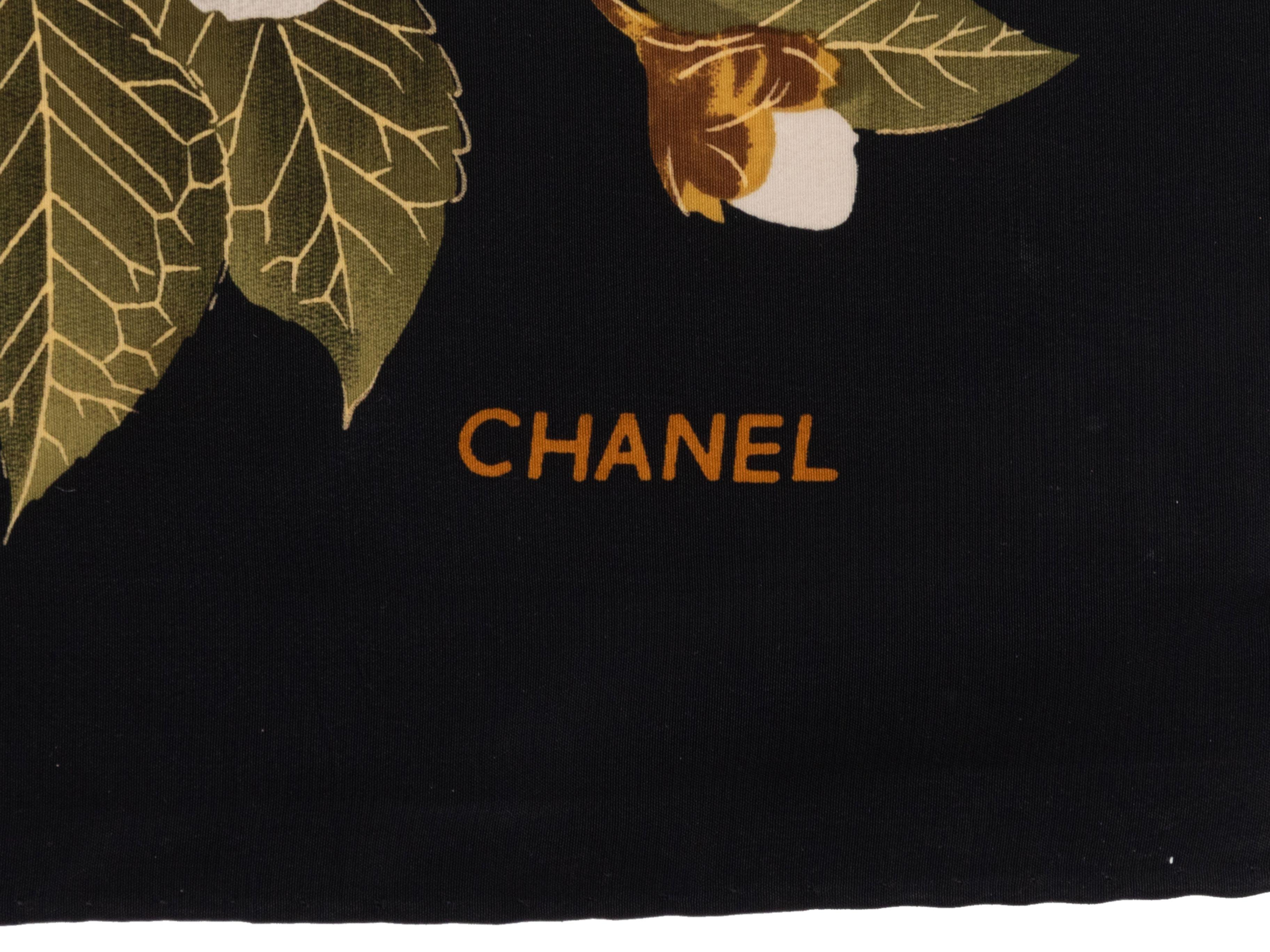 Product Details: Black and multicolor camellia print silk scarf by Chanel. 33