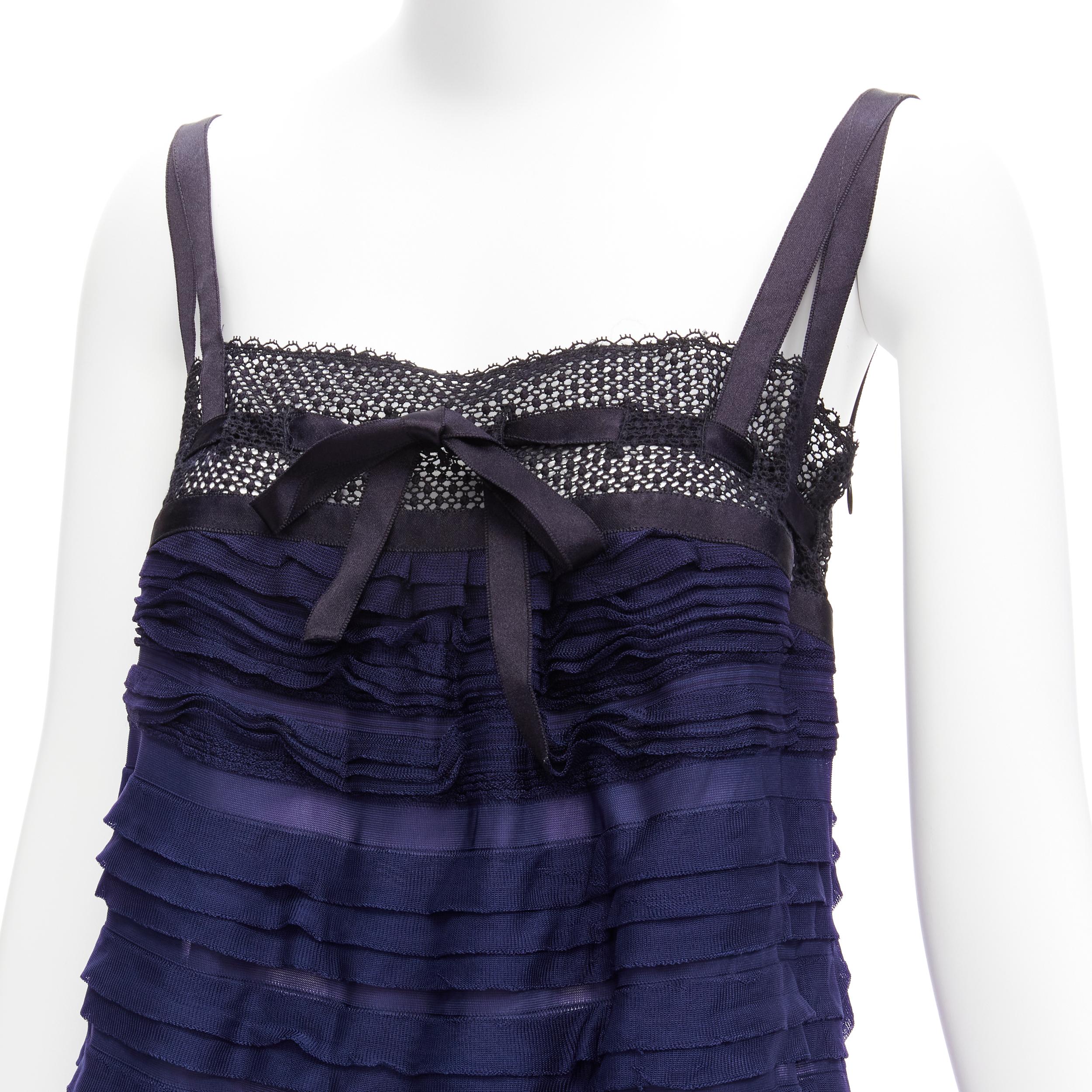 CHANEL black navy CC logo ribbon pleat tiered layered vest top FR40 L
Reference: TGAS/D00180
Brand: Chanel
Designer: Karl Lagerfeld
Material: Viscose
Color: Black, Blue
Pattern: Solid
Closure: Pullover
Extra Details: CC logo plate at front hem left