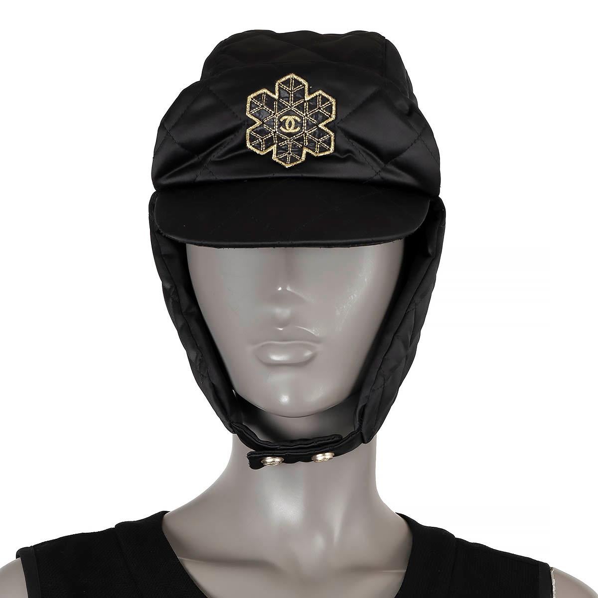 100% authentic Chanel trapper hat in black quilted and padded polyester (100%) embellished with golden snowflake CC patch. Lined in black cotton (100%). Has been worn and is in excellent condition. 

2019 Coco Neige

Measurements
Model	19N
Tag