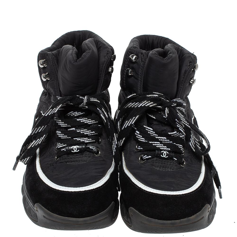 Exude high style in these super-stylish sneakers from the house of Chanel! They are carefully crafted from nylon and suede, and designed with laces on the vamps and thick quilted soles. You are sure to receive both comfort and fashion when you