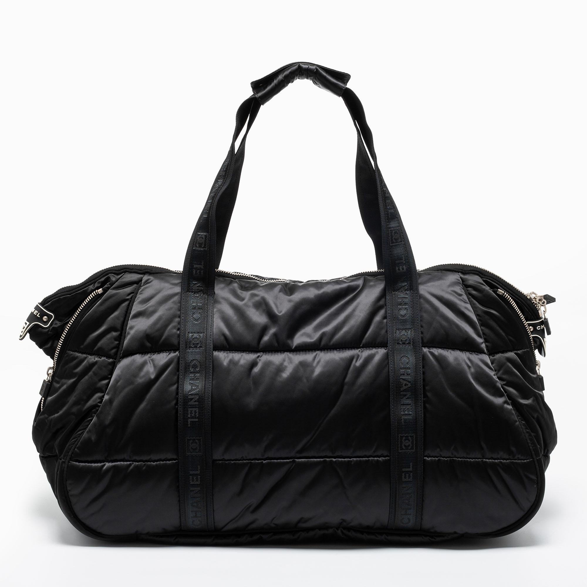 Experience fine craftsmanship with this immaculately designed nylon CC Sport Ligne Duffle bag by Chanel. It has two branded handles, a front CC logo, and a lined interior.

Includes: Original Dustbag, Authenticity Card, Info Booklet