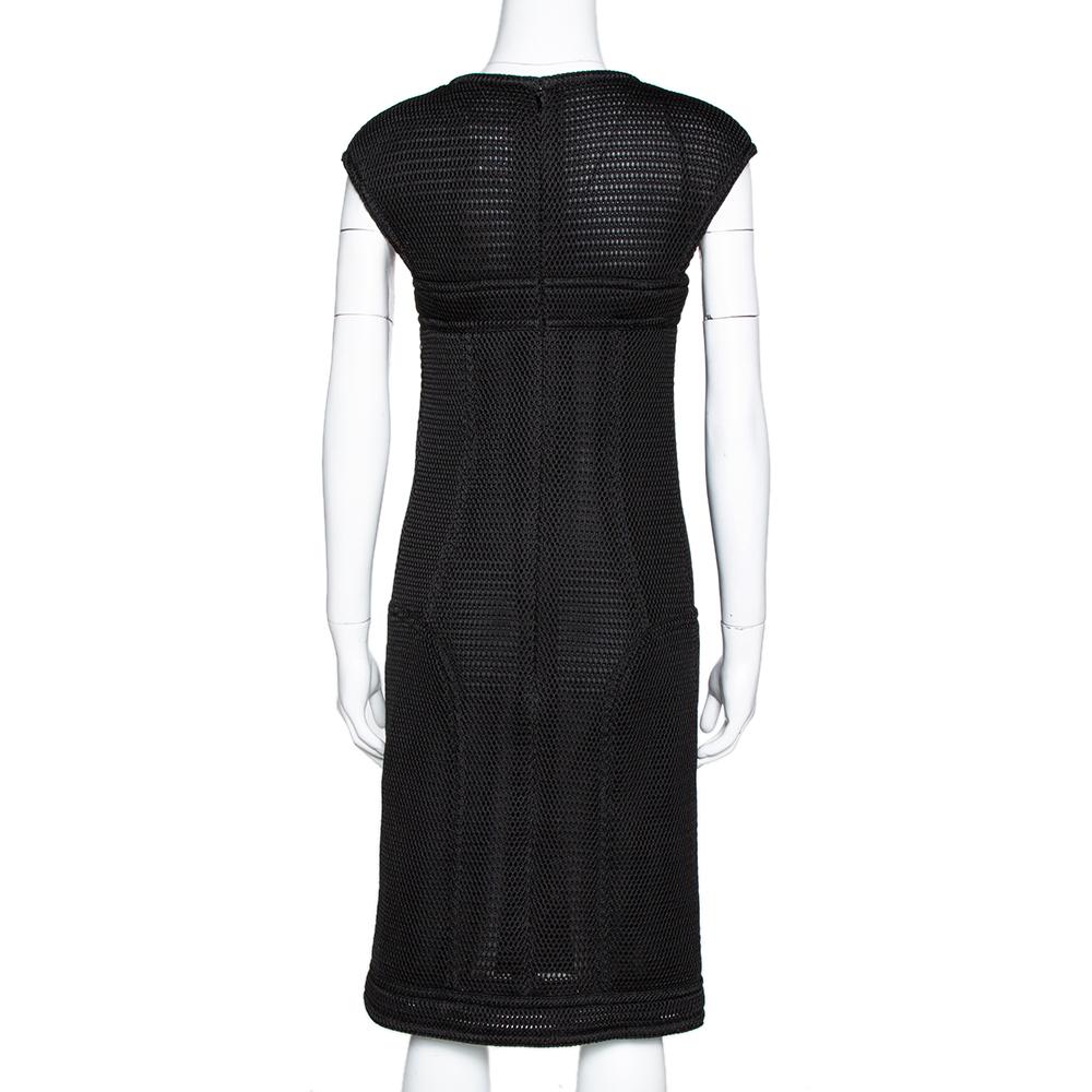 To infuse a feminine style into your elegant formal looks, pick this sheath dress from the house of Chanel. It features a mesh body made from 100% nylon and is adorned in a black shade. A simple design, concealed zip closure at the rear, and fitted