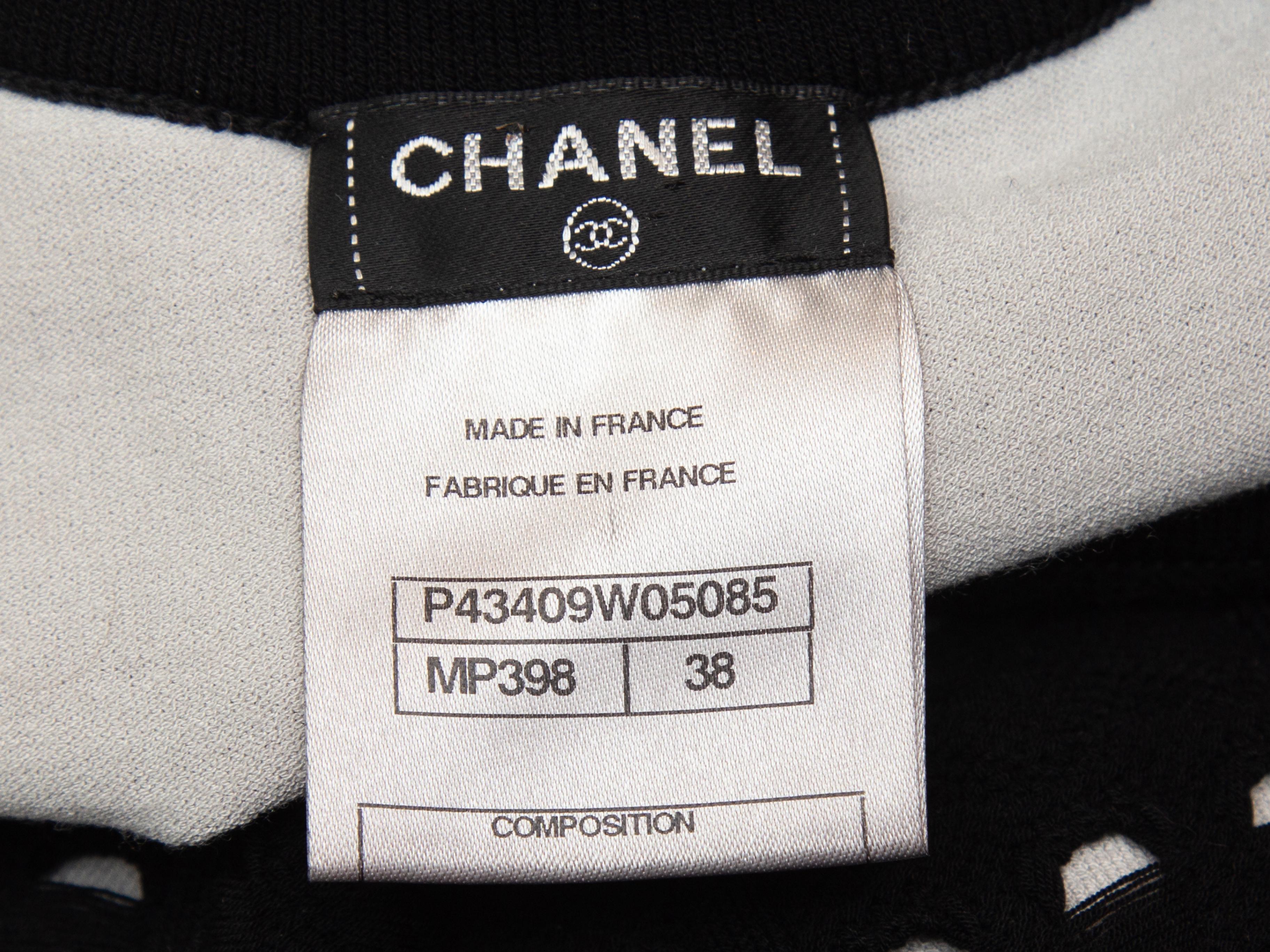 Product details: Black open knit sleeveless dress by Chanel. Crew neck. Designer size 38. 32