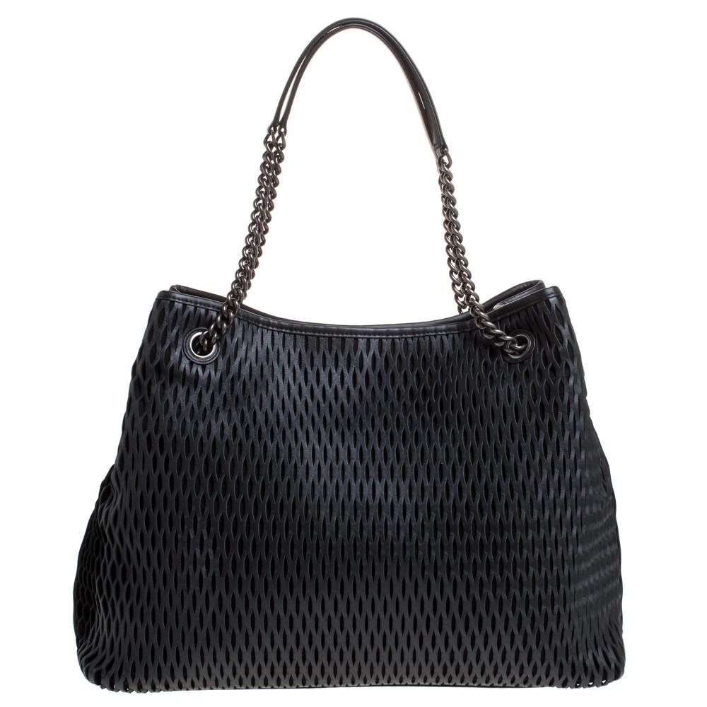 We all need something in our closets that will never go out of style. This unique tote from Chanel is classy and well-made that it is bound to last and give you ceaseless style. It has been crafted leather flaunting a black shade, orange CC logo at