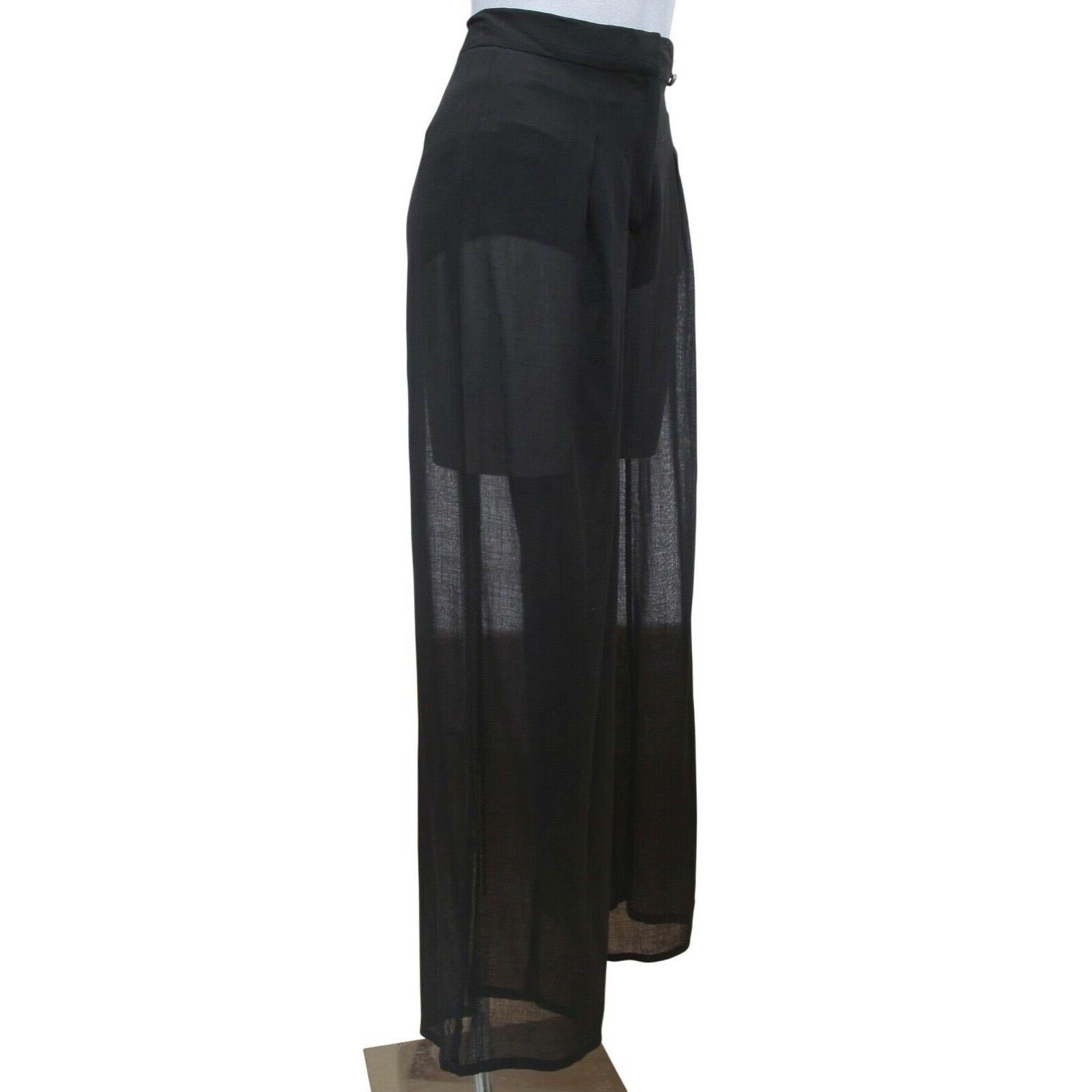 GUARANTEED AUTHENTIC CHANEL BLACK SEMI-SHEER EVENING WIDE LEG PANT

Details:
• Black wool blend pant.
• High rise.
• Wide leg.
• Lightweight, sheer at tight to hem area.
• Black CC plaque at left waist.
• Front concealed zipper with hook-n-eye and