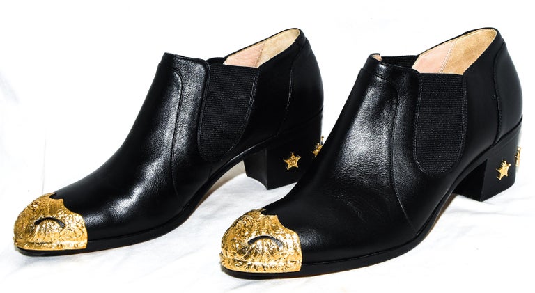 Chanel Black Paris to Dallas Ankle Booties Gold Tone Cap and Sheriff's  Badges Heel For Sale at 1stDibs