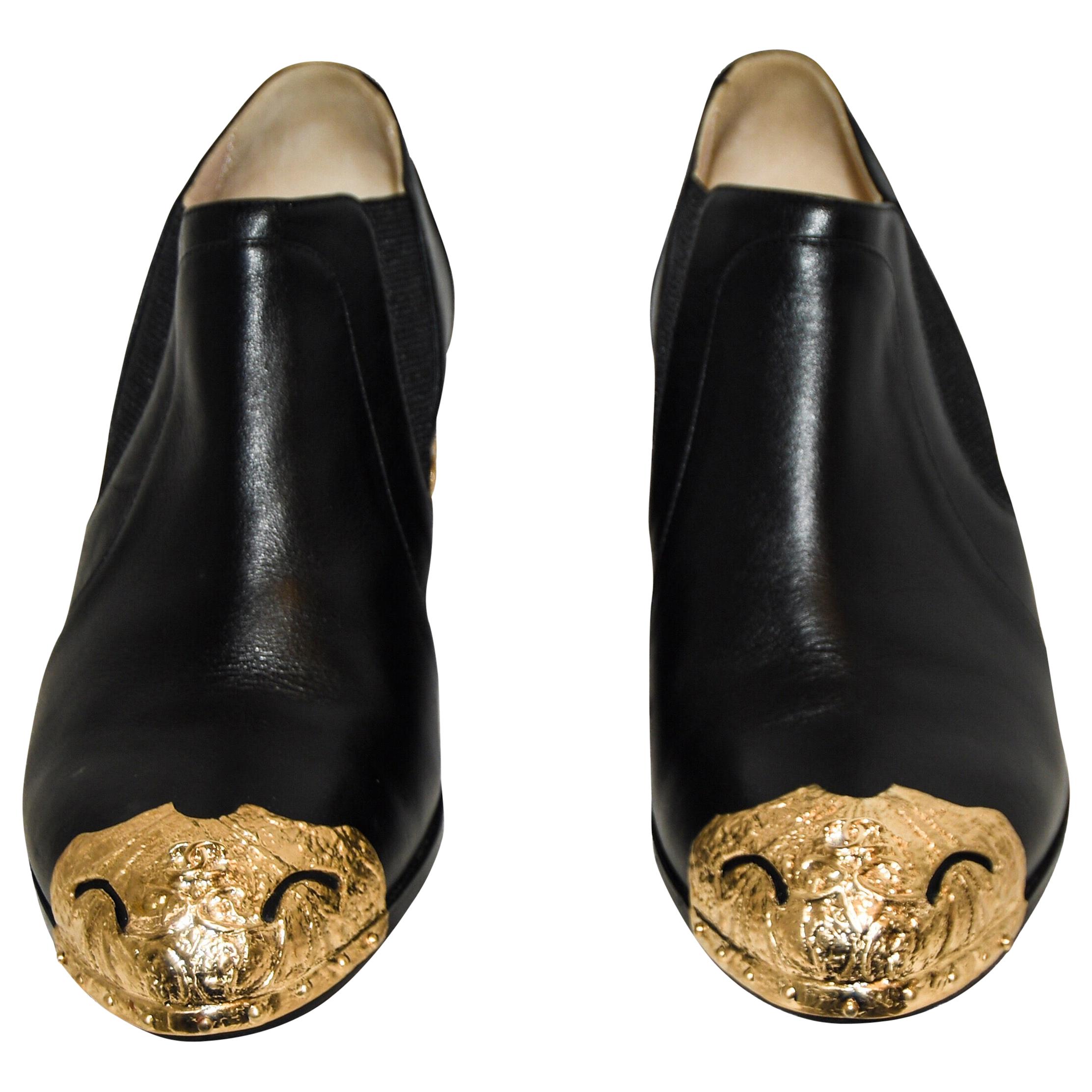 Chanel Black Paris to Dallas Ankle Booties Gold Tone Cap and Sheriff's  Badges Heel For Sale at 1stDibs