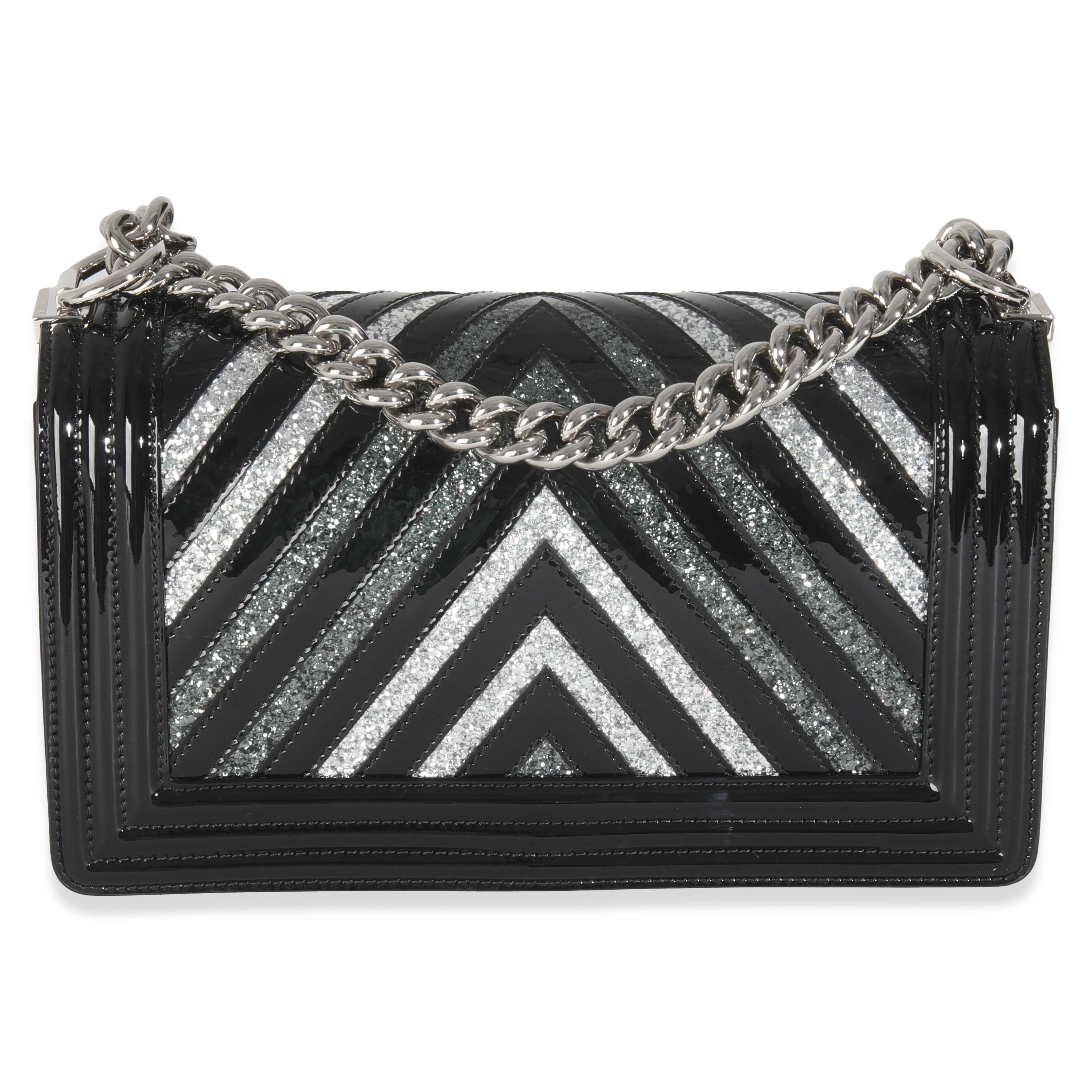 Listing Title: Chanel Black Patent Chevron Glitter PVC Old Medium Boy Bag
SKU: Z146029
Condition: Pre-owned 
Condition Description: An instant classic, the Boy bag from Chanel was introduced in 2011. The quilted bag was designed by the late Karl