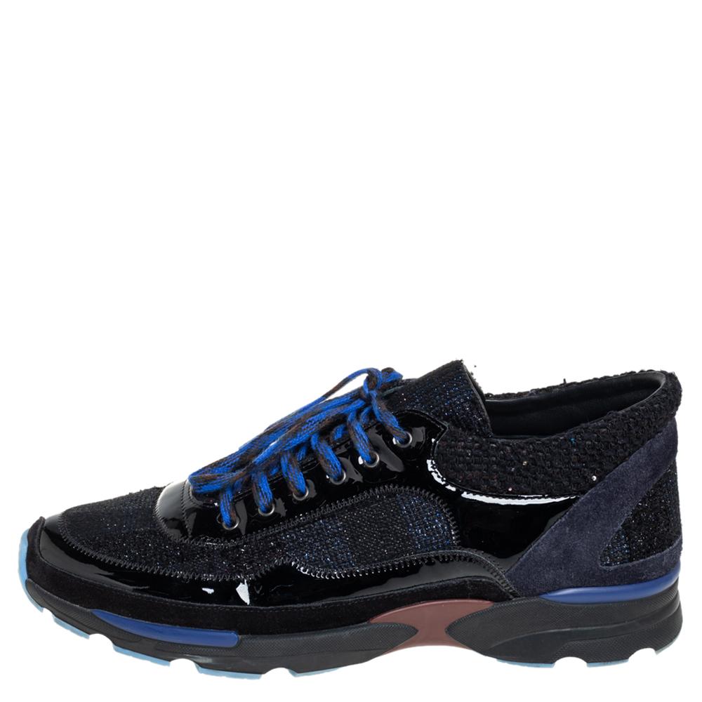 These black sneakers from Chanel are just what you need to add to your style. They are crafted from patent leather, suede, and tweed in a low-top silhouette and feature round toes and lace-ups on the vamps. They flaunt the iconic CC logo detailing