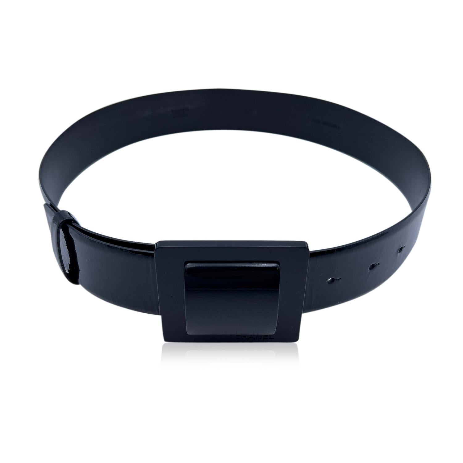 CHANEL black patent leather belt with black squared buckle. 'Chanel - 07 CC A - Made in Italy' engraved on the reverse of the belt. Size 36. Width: 1.6 inches - 4 cm. Total length of the strap: 33.25 inches - 84.5 cm. From buckle to first notch
