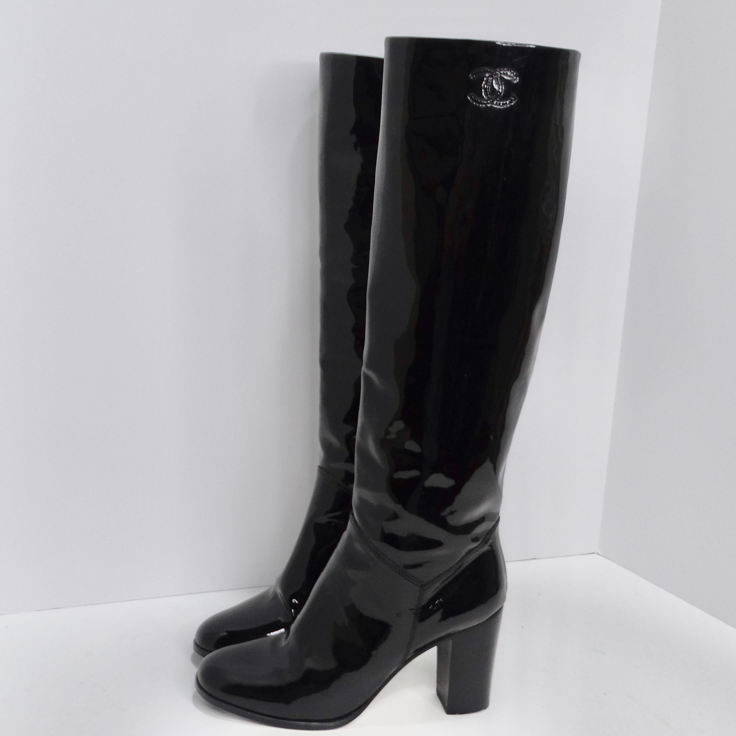 Elevate your footwear game with these iconic Chanel Black Patent Leather Boots. These knee-high boots are a quintessential piece of fashion history, offering a timeless blend of sophistication and style that only Chanel can deliver. Crafted from
