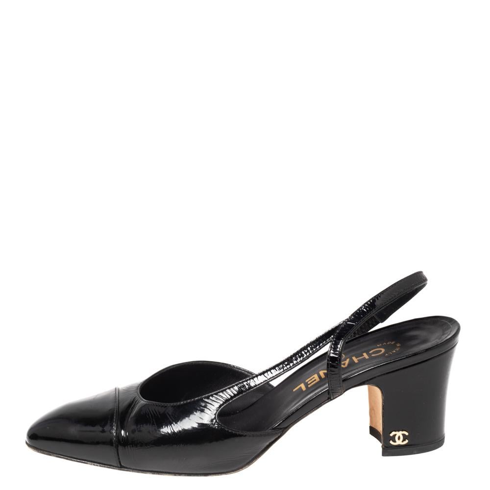 Revamp your attire by wearing these slingback sandals from Chanel. They have been designed using black patent leather on the exterior and are adorned with cap-toes, gold-toned hardware, and block heels. Add a feminine touch to your feet by wearing