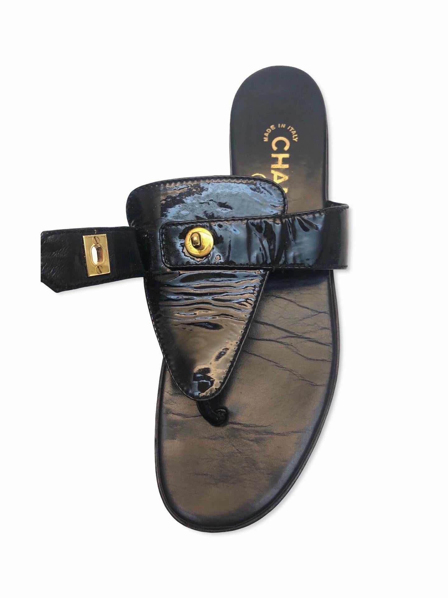 - This rare Chanel black patent leather sandals is made in the 90s. 

- Featuring a CC gold hardware turn-lock that you can literally unlock it and lock it any way you want. (Shown in the pictures below of how it can be done). 

- Most interesting