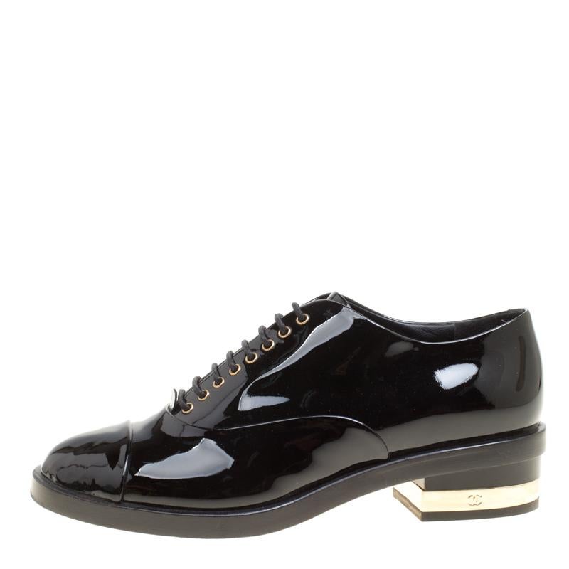 Very chic and smart, these oxfords from Chanel will definitely make you stand out! The black oxfords are crafted from patent leather and feature round toes, lace-ups on the vamps, comfortable insoles and 4 cm gold-tone hardware detailed heels that