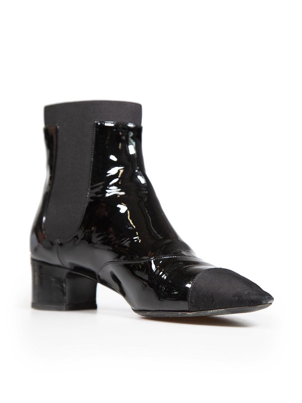CONDITION is Good. Minor wear to shoes is evident. Light signs of wear to both cloth cap toes with abrasion, creasing on the leather and abrasions on the front and back of the right shoe and the right side of the left shoe on this used Chanel
