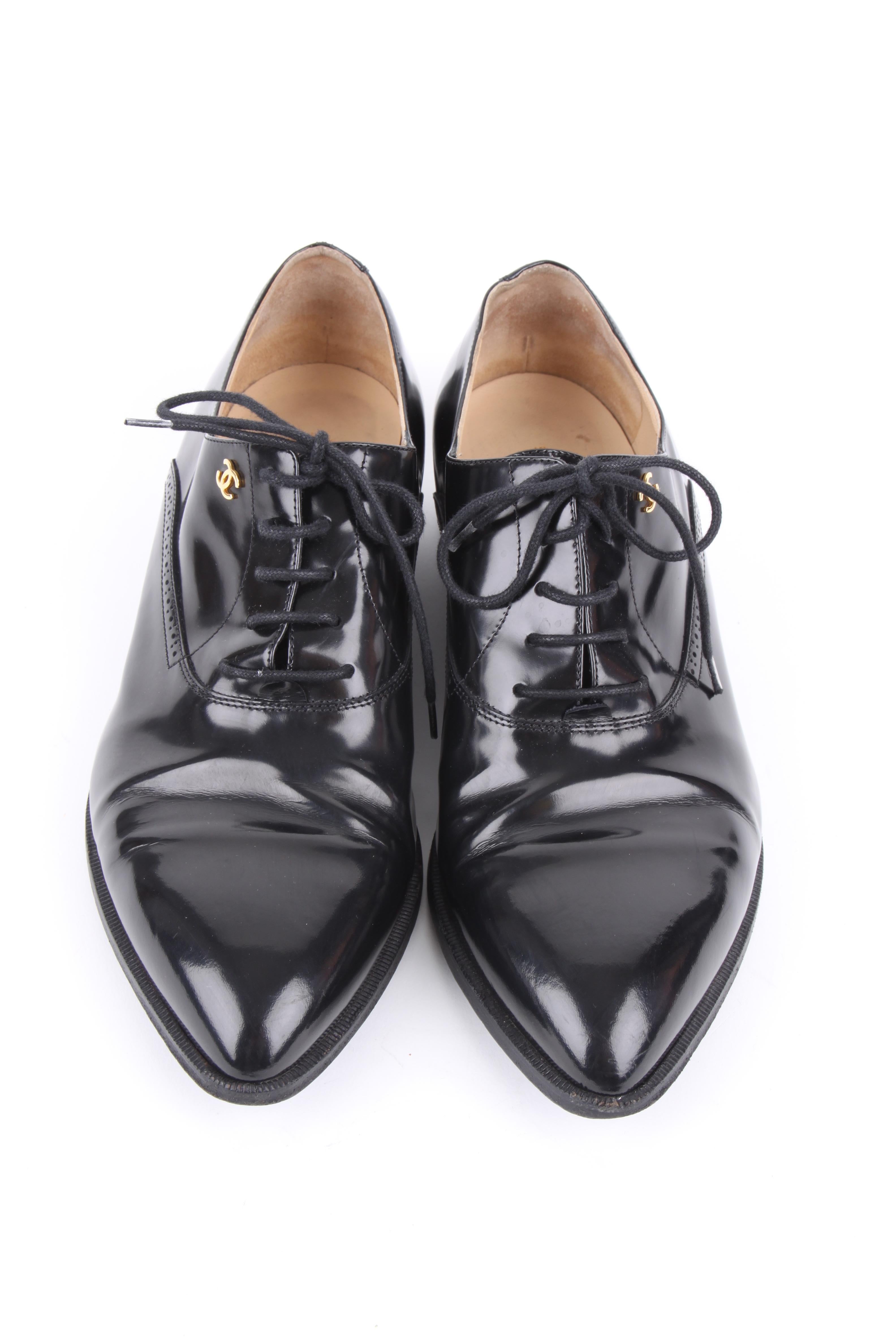 Chanel black patent leather CC logo pointed-toe loafers.

These loafers have a traditional, classic design, which is accented by the lovely smooth and shiny polished patent leather and the embossed CC Chanel logo so you will never have to bother