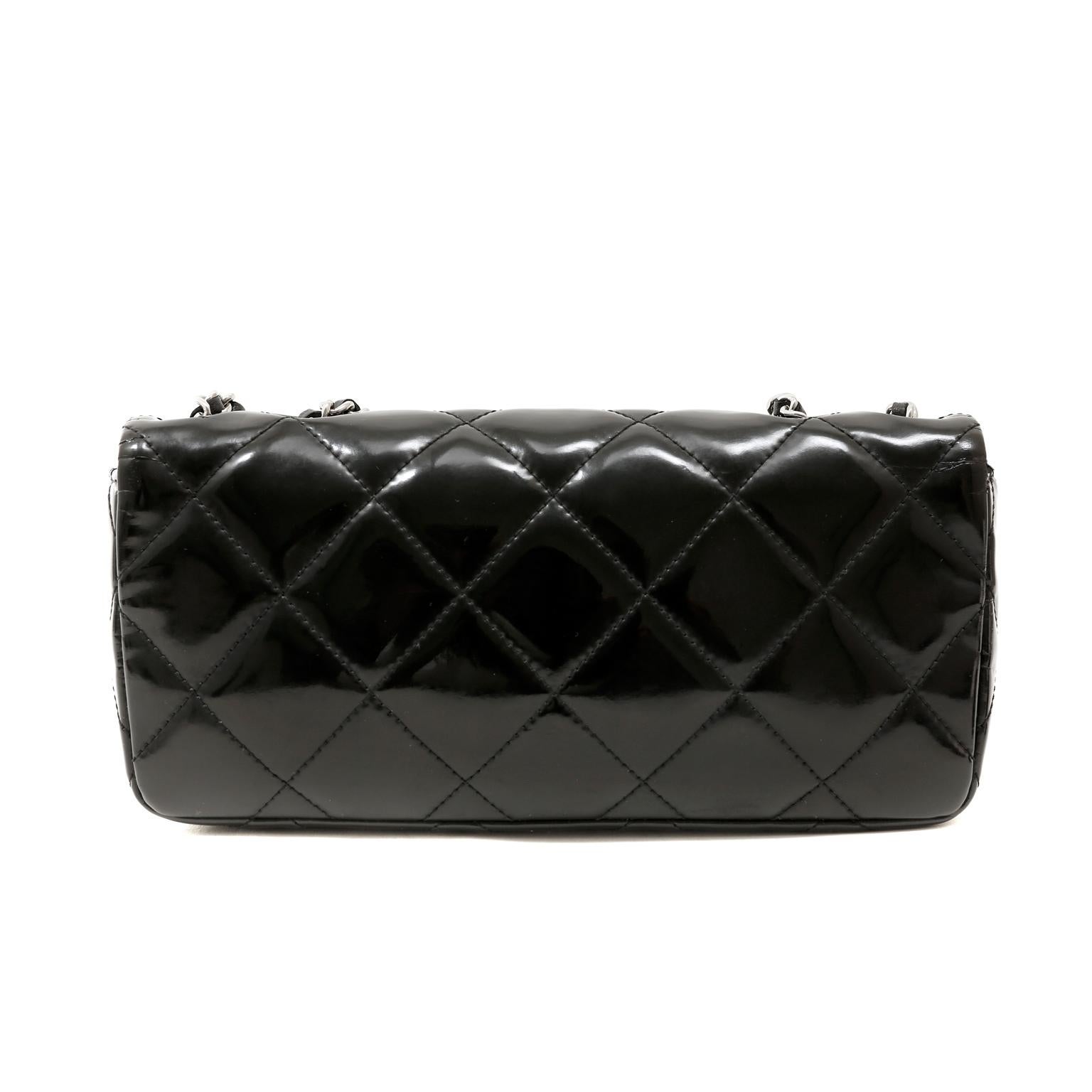 This authentic Chanel Black Patent East West Reissue Flap Bag is in very good condition.  Just the right size for day or evening, this versatile Chanel adds dimension to any wardrobe.  
Black weather friendly patent leather is quilted in signature