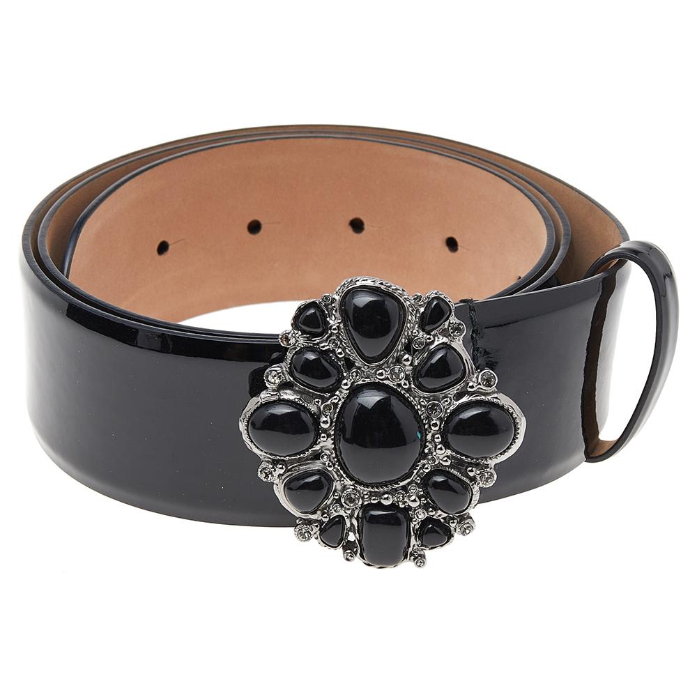 Created with minute attention to detail and unmatched skill, this belt from the House of Chanel will certainly add refinement and elegance to your entire attire. It has been made from black patent leather with an embellished buckle decorating the