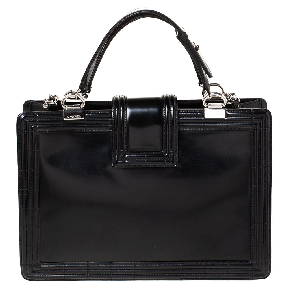 We all need one tote that will not only help assist our style but also be durable enough for our shopping sprees. Here's one from Chanel. It comes finely crafted from glossy patent leather and designed with the signature 'Boy' style, a strap closure