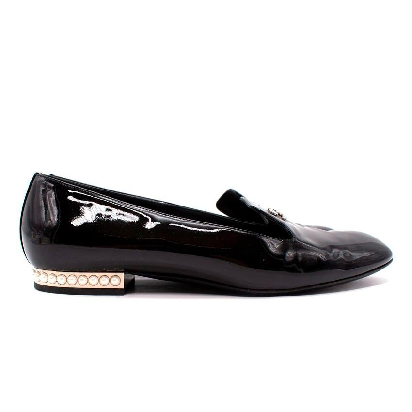 Chanel Black Patent Leather Pearl Heel Loafers
 

 - Classic loafer shape updated with glossy patent leather, faux pearl heel trim, and silver-tone CC logo
 - Supple leather, slip-on style
 

 Materials:
 Leather
 

 Made in Italy
 

 PLEASE NOTE,