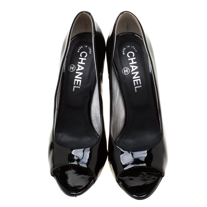 In a magical blend of luxury and elegance, these sandals come crafted from black patent leather and designed with peep toes and the metal detailing with the CC logo on the heels add the perfect finishing touch to the pair.

Includes: The Luxury