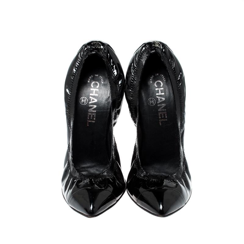These black Chanel pumps are elegant and feminine. Made from patent leather, they flaunt pointed toes, leather insoles with the brand label and a scrunch style to give you a good fit. The pair is complete with 11.5 cm heels.

Includes: Original