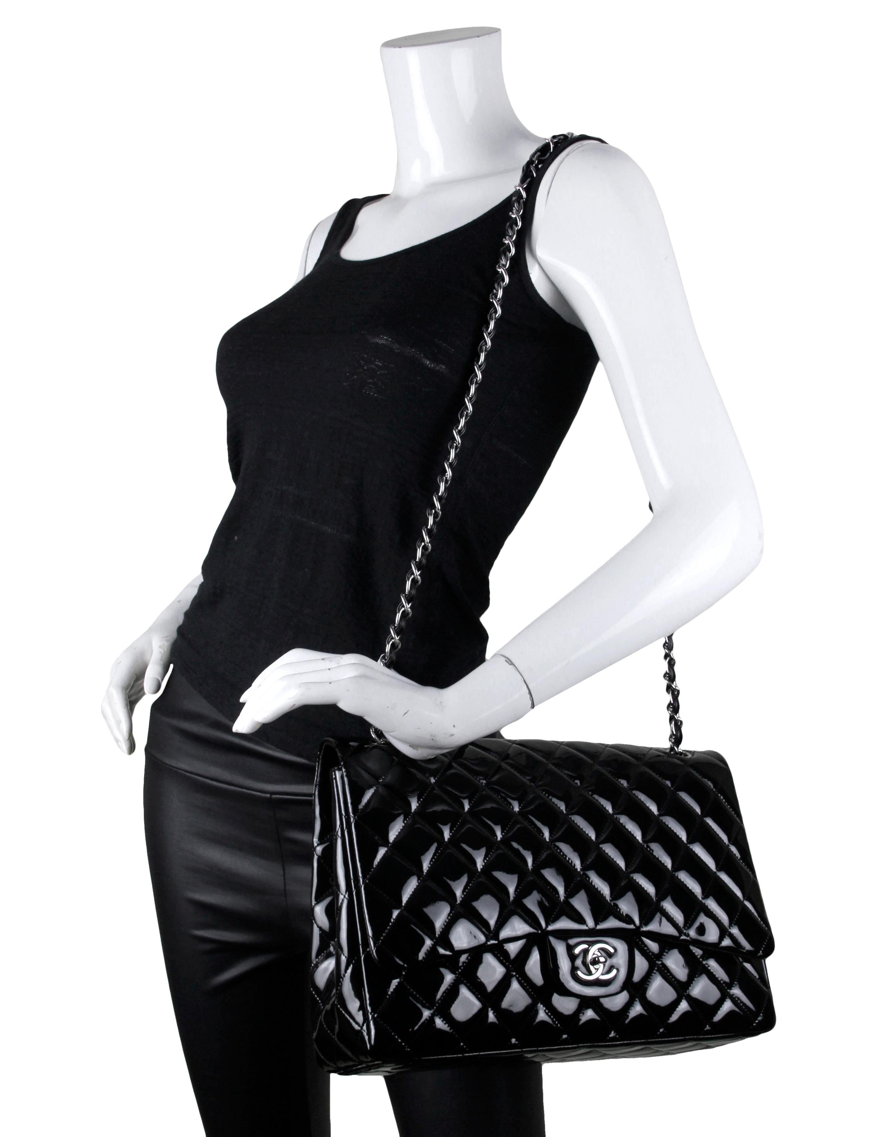 Chanel Black Patent Leather Single Flap Maxi Bag

Made In: Italy
Year of Production: 2009-2010
Color: Black
Hardware: Silvertone
Materials: Patent leather
Lining: Black smooth leather
Closure/Opening: Flap top with CC twistlock
Exterior Pockets:
