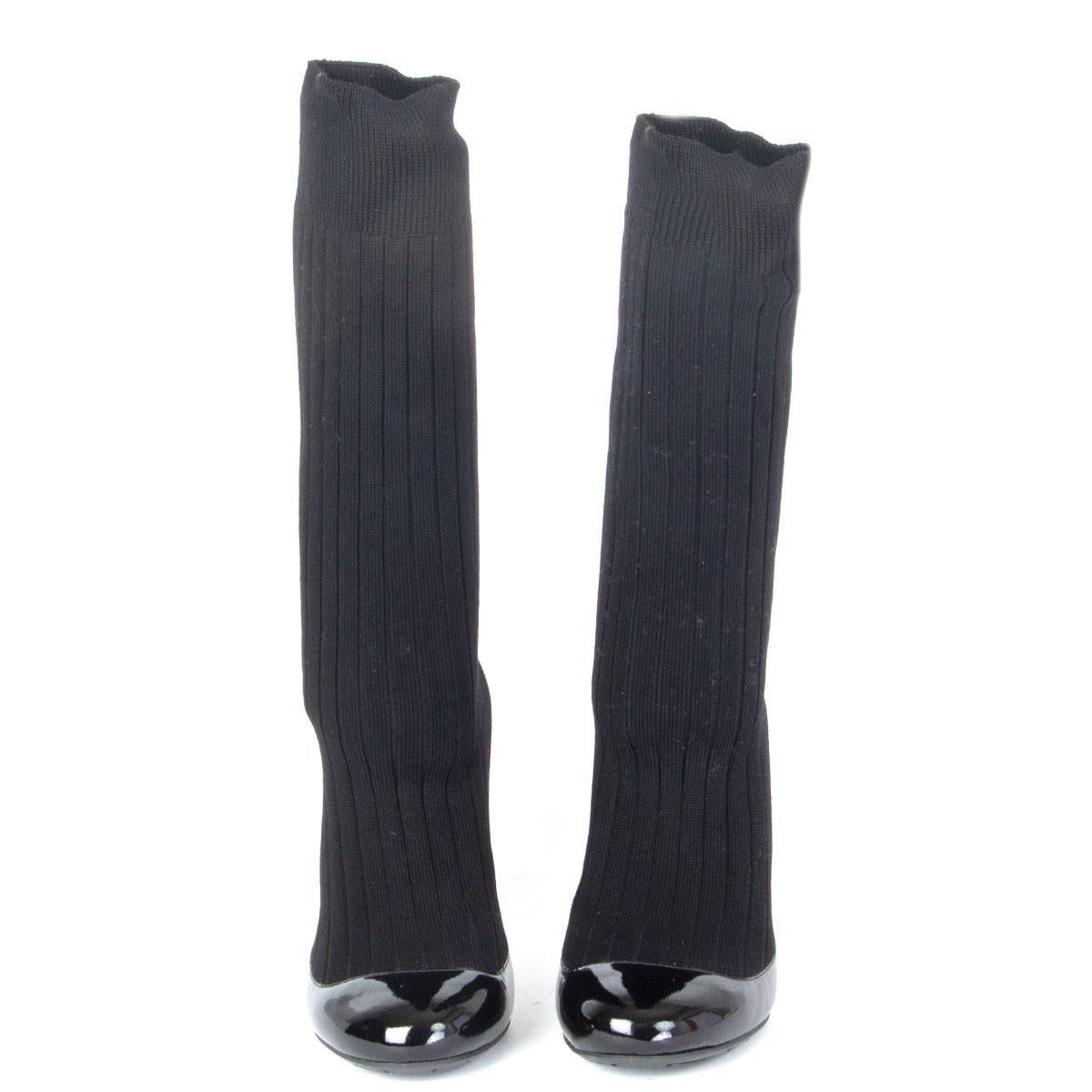 authentic Chanel round-toe ribbed sock pumps in black patent leather. Spring/Summer 2014 runway. Have been worn and are in excellent condition. 

Imprinted Size 38
Shoe Size 38
Inside Sole 25cm (9.8in)
Width  7cm (2.7in)
Heel10cm (3.9in)
Shaft 25cm