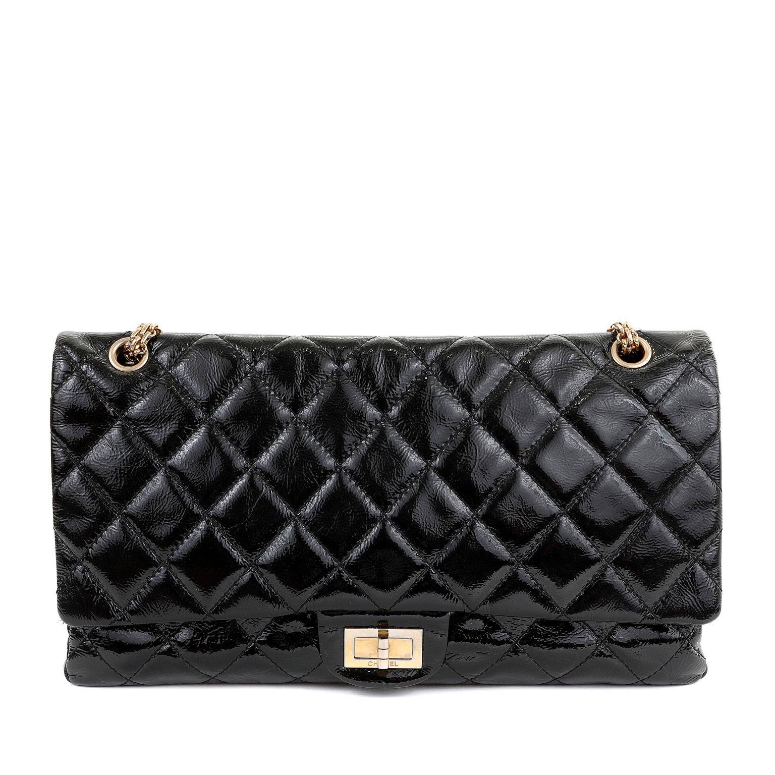 This authentic Chanel Black Patent Leather XL Reissue Flap Bag is in excellent vintage condition. Black weather friendly patent leather is quilted in signature Chanel diamond pattern.  Gold tone mademoiselle twist lock secures the exterior flap. 