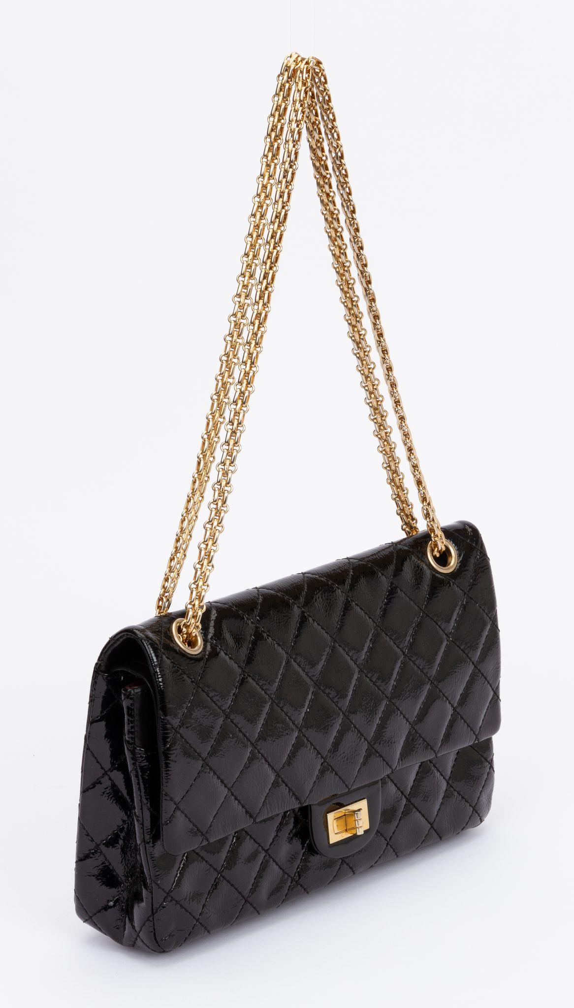 Chanel black patent leather medium reissue double flap with gold tone hardware. Shoulder strap drop 8