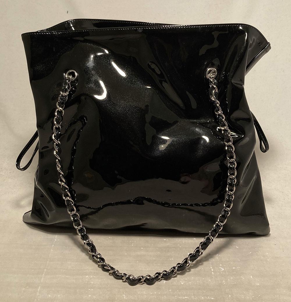 Chanel Black Patent Strass Crystal Bon Bon Logo Tote in excellent condition. Smooth black patent leather exterior with front Strass rhinestone crystal CC logo design. Double woven silver chain and leather shoulder straps. Drawstring leather pulls on
