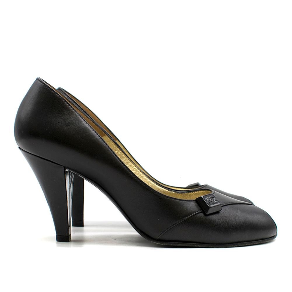 Chanel Black Peep-Toe Leather Pumps

- Cross front open toe shoe,
- Logo on front of shoe,
- Patent black leather
- Mid-height heel

Please note, these items are pre-owned and may show some signs of storage, even when unworn and unused. This is