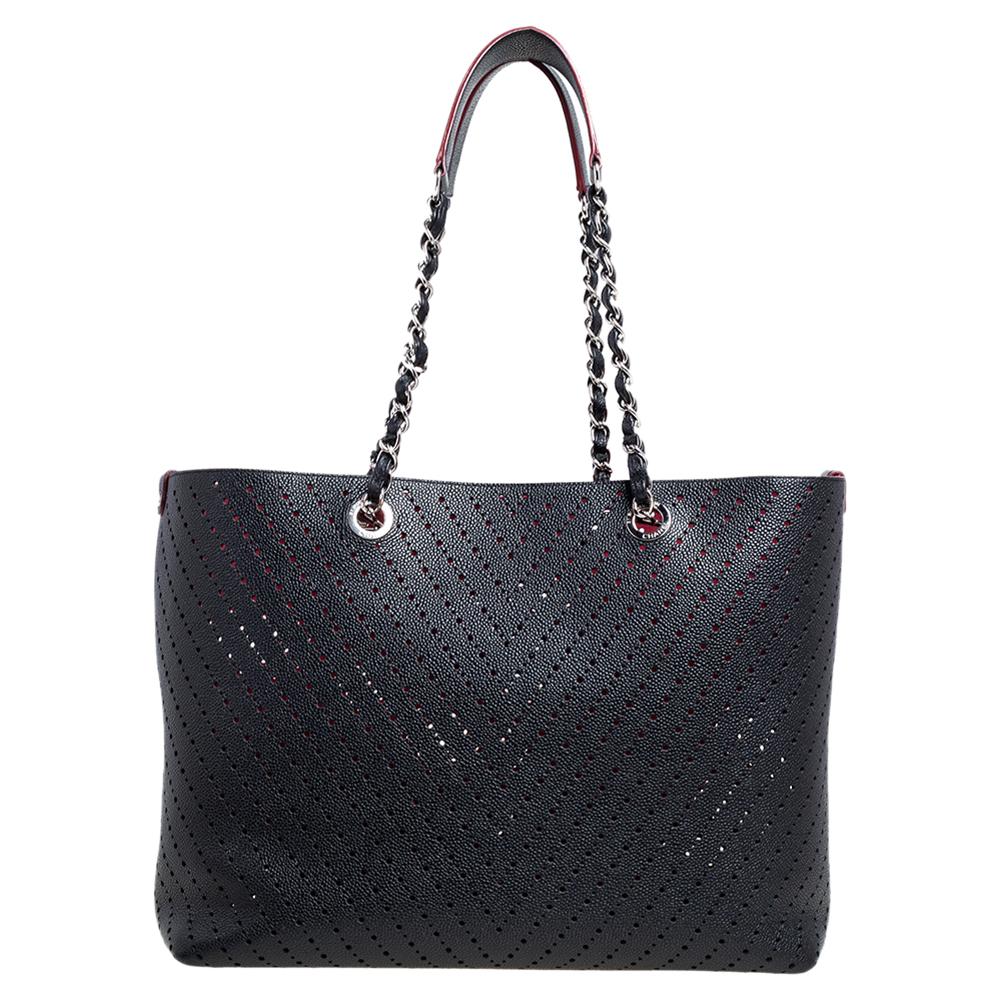 Every Chanel creation deserves to be etched with honor in the history of fashion as they carry irreplaceable style. Like this stunner of a Shopping tote that has been exquisitely crafted from perforated Caviar leather. It has a stunning black hue,