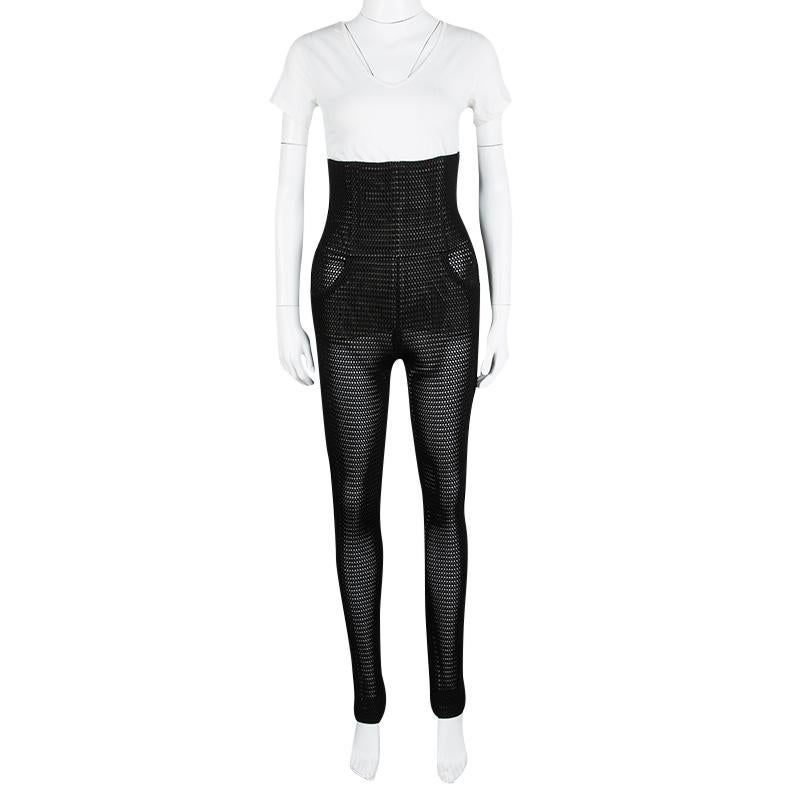This pair of high waist trousers from Chanel will definitely be one unique addition to your closet. It has been made from nylon in France and designed in a perforated style with silk lining.

Includes: The Luxury Closet Packaging



