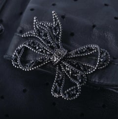 Chanel Black Perforated Lambskin Fingerless Gloves with Crystal Bow Detail - 10s