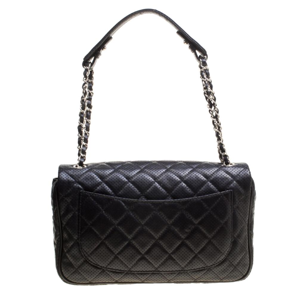 Chanel's Flap Bags are iconic and monumental in the history of fashion. Crafted from black perforated leather the bag features the iconic quilted pattern on the exterior. The interior is fabric lined housing a slip and a zip pocket. The bag features