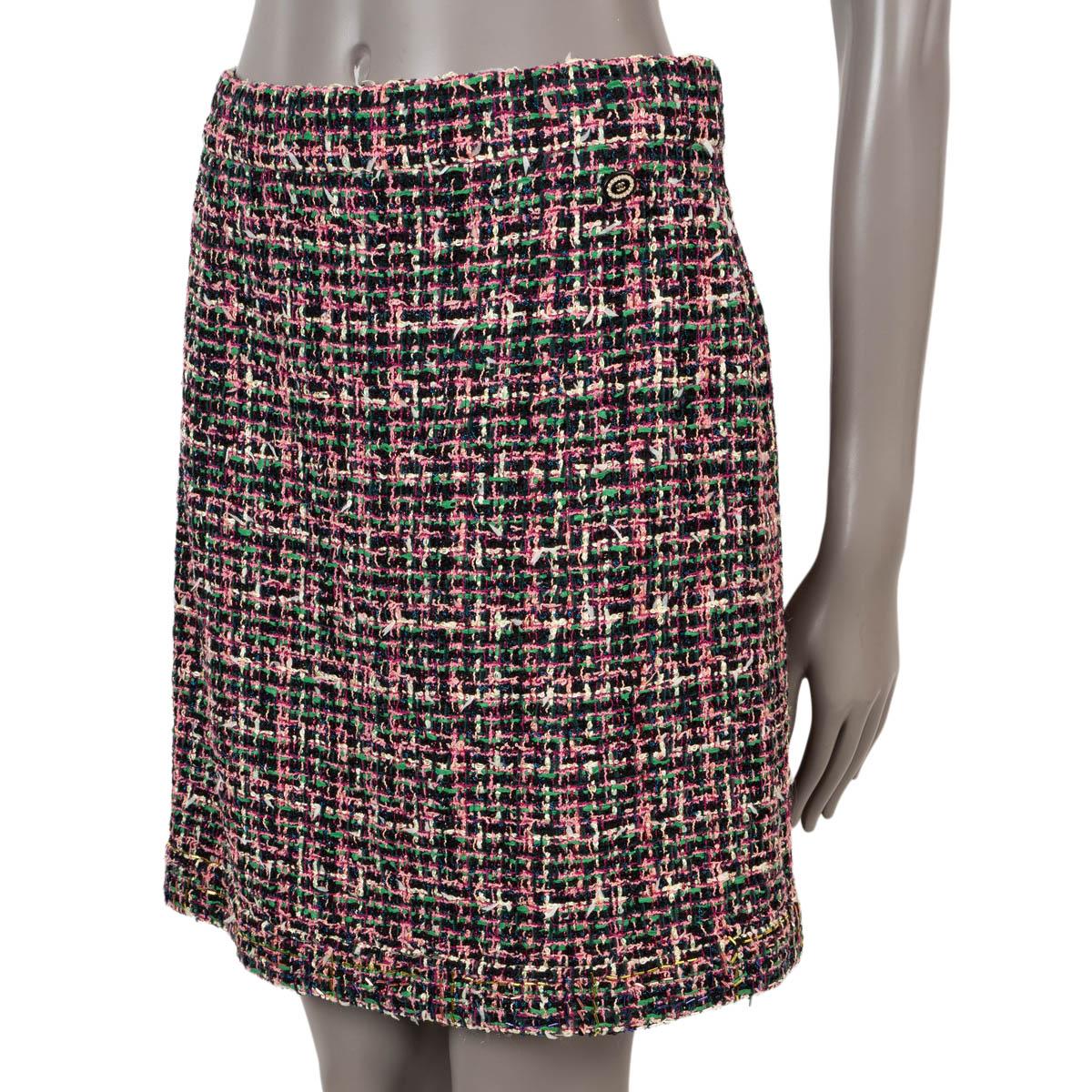 100% authentic Chanel below-knee tweed skirt in pink, black, green, blue and yellow polyamide (55%), polyester (14%), viscose (11%), cotton (10%), wool (6%) and polyurethane (4%). Lined in black silk (100%). The hem is embellished with gold, silver,