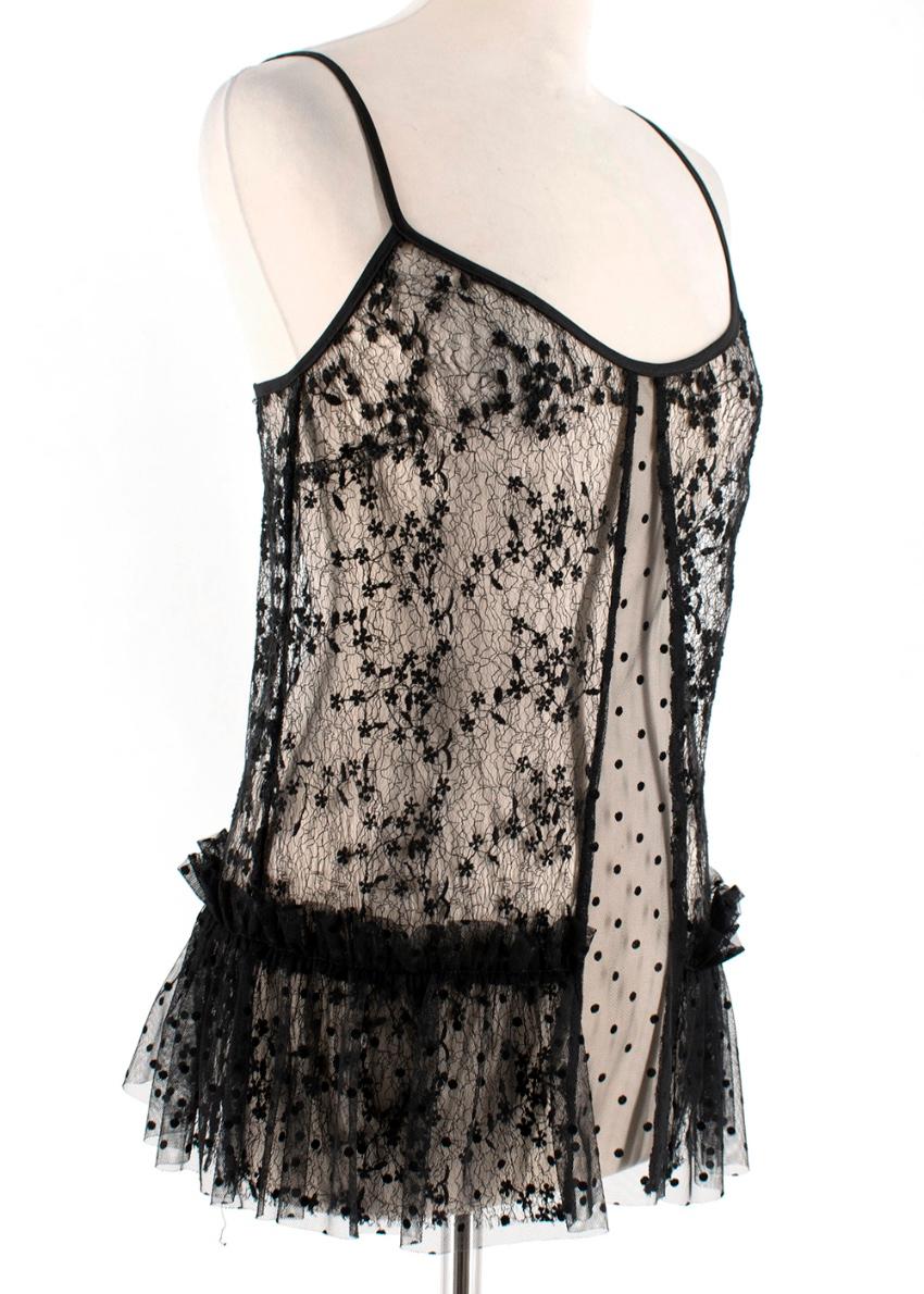 Chanel Lace Panelled Sleeveless Top 

- Sleeveless
- Two Lace Textures 
- Rounded Neckline 
- Fluted Hemline 
- Layered Lace at Hemline 

Made in France 

THERE IS NO SIZE LABEL, HOWEVER BASED ON THE VIP SELLER'S USUAL SIZE AND OUR APPROXIMATE