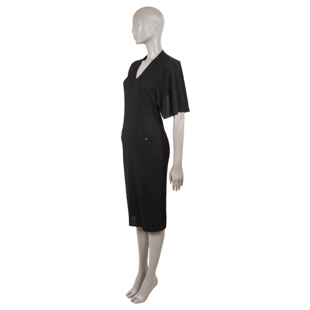 100% authentic Chanel backless cape sleeve ribbed knit dress in black polyester (52%) and curpo (48%) (please note the content tag is missing). The design features a v-neck and two classic patch-pockets at front. Has been worn once and is in
