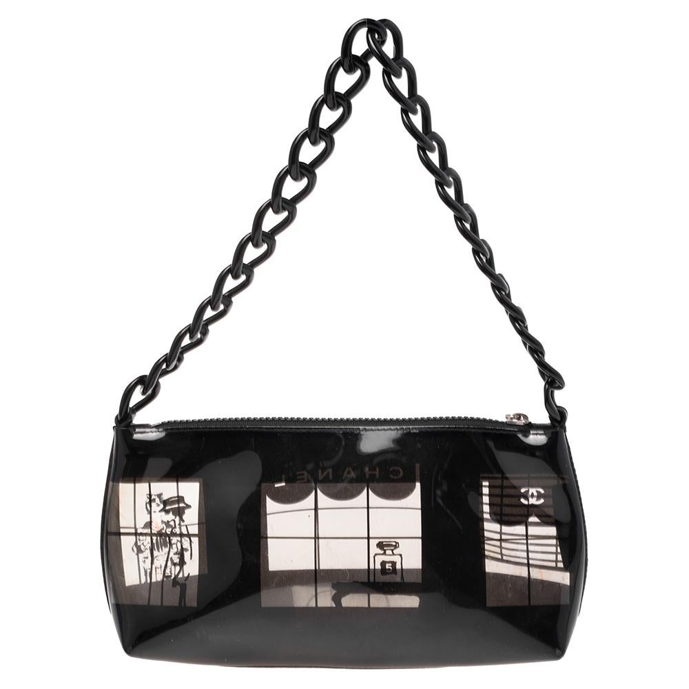 Stay ahead of the trend with this tote from the house of Chanel. Crafted from PVC, this bag is designed with a lovely print on the exterior depicting the Mademoiselle Chanel through a window. The bag is secured by a zip closure and comes fitted with