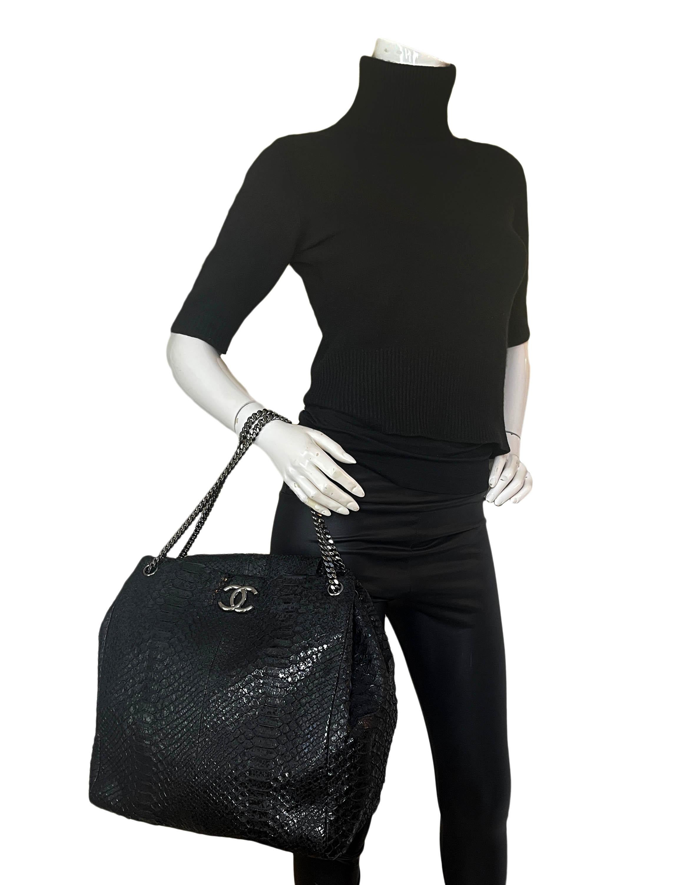 Chanel Black Python CC Accordion Large Chain Tote Bag

Made In: France
Year of Production: 2008
Color: Black
Hardware: Darkened silvertone
Materials: Python snakeskin
Lining: Black fine textile
Closure/Opening: Flap top with magnet
Exterior Pockets: