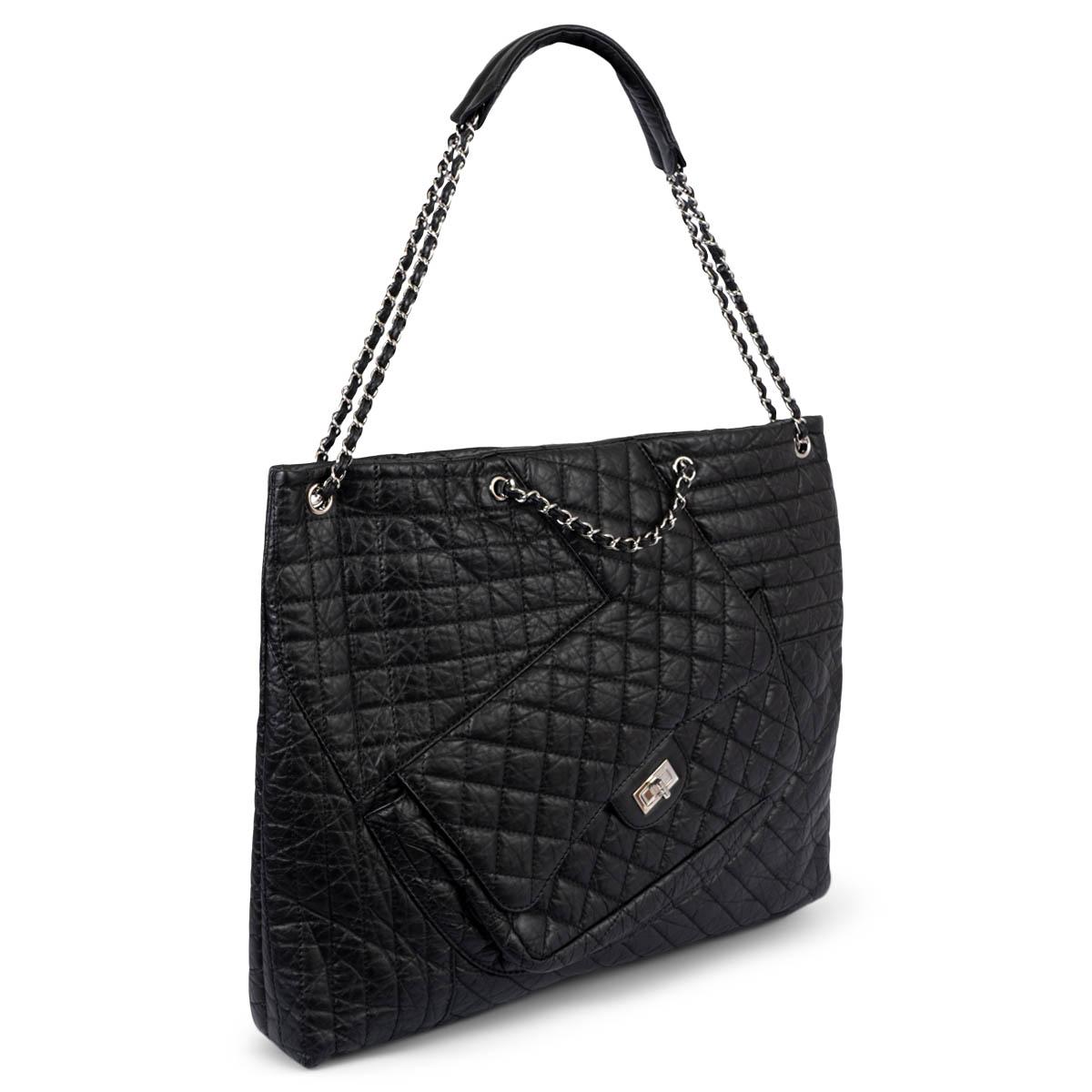 100% authentic Chanel Karl Cabas tote in black quilted aged calfskin leather featuring silver-tone hardware. The design comes with silver-tone chain link leather threaded shoulder straps with shoulder pads and patch pockets on the rear with a