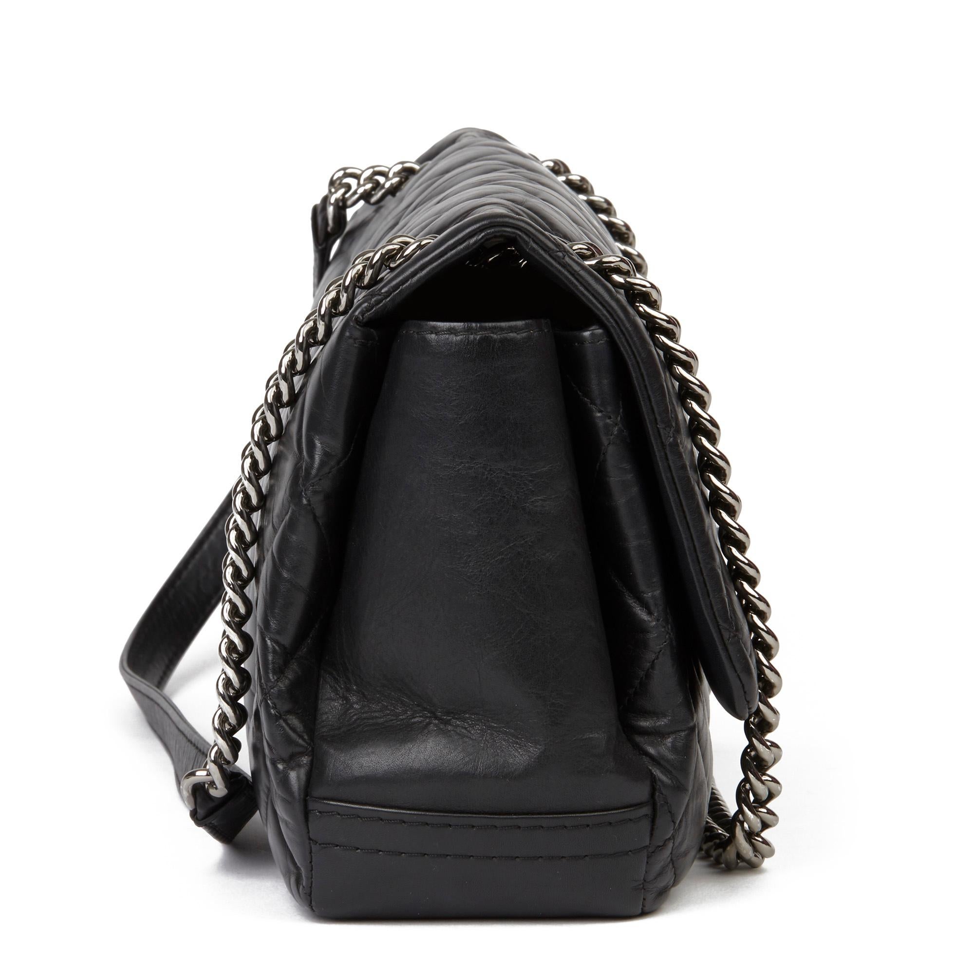 CHANEL
Black Quilted Aged Calfskin Leather Jumbo Lady Pearly Flap Bag

Xupes Reference: HB3430
Serial Number: 16883247
Age (Circa): 2012
Accompanied By: Chanel Dust Bag, Authenticity Card, Invoice
Authenticity Details: Authenticity Card, Serial