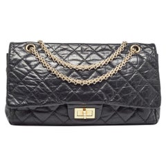Borsa Chanel nera trapuntata in pelle invecchiata 227 Reissue 2.55 con pattina