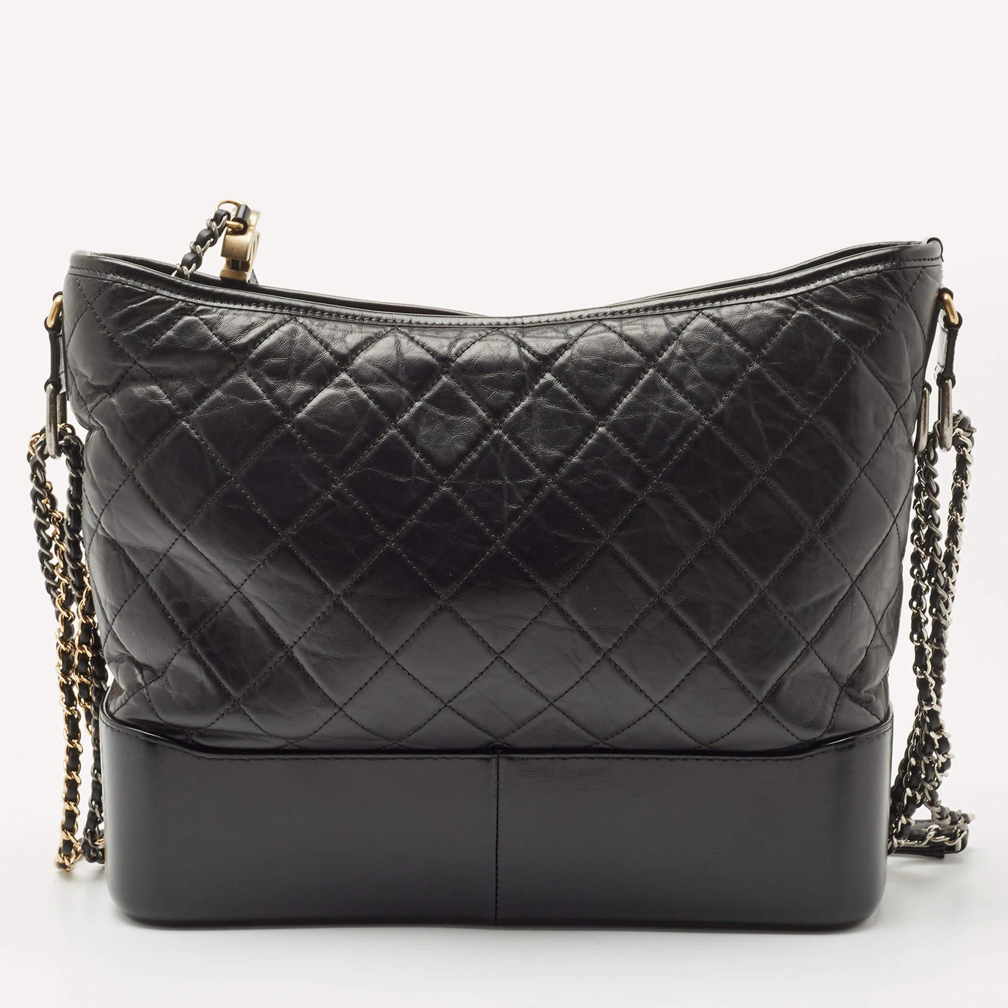 Get yourself this beautiful Gabrielle bag from the iconic house of Chanel. It exudes style and will always deliver sophistication. Crafted in Italy and made from aged leather, it comes in lovely shades of black. The exterior flaunts the signature