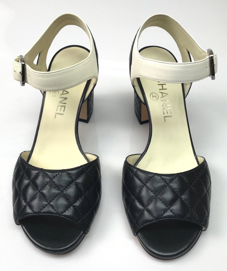 CHANEL BLACK Quilted Ankle Strap Sandal - 36. These adorable Chanel sandals are in excellent condition. They show barely any use, with exception to the bottom of the shoe, shown in pictures. They are made of black quilted leather and have a white