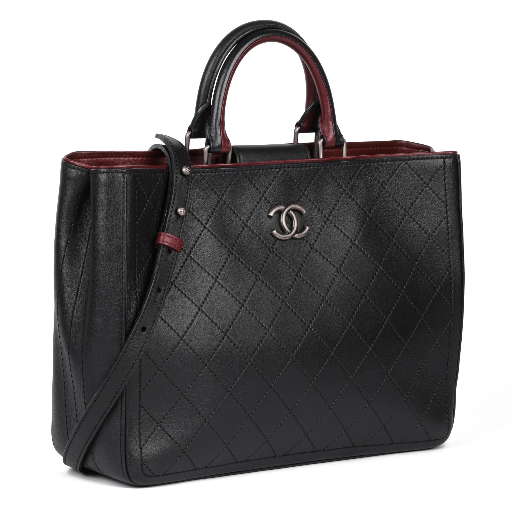 CHANEL
Black Quilted Bullskin Leather & Burgundy Large Classic Shopping Tote

Serial Number: 24351373
Age (Circa): 2018
Accompanied By: Chanel Dust Bag, Box, Authenticity Card, Shoulder Strap
Authenticity Details: Authenticity Card, Serial Sticker