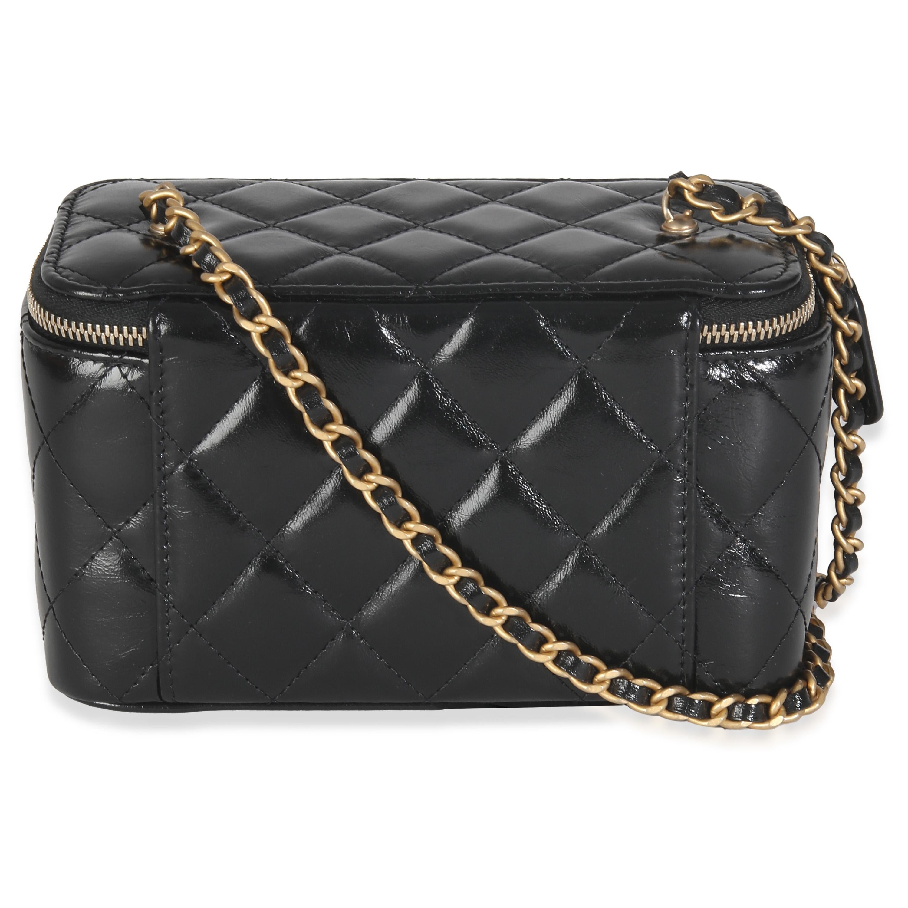 Listing Title: Chanel Black Quilted Calfskin Chain CC Vanity
SKU: 146243
Condition: Pre-owned 
Handbag Condition: Excellent
Condition Comments: Item is in excellent condition and displays light signs of wear. Faint scuff along exterior.  Minor